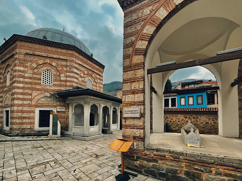 Bursa, Turkey - November 19, 2021.Tombs at the Muradiye Complex in Bursa, with Shehzade Ahmed tomb in the foreground. Shehzade Ahmed was an Ottoman prince who fought to gain the throne of the Ottoman Empire