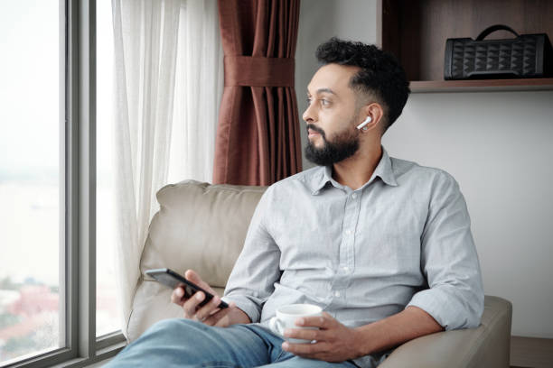 istock Man Enjoying Good Music 1357615993