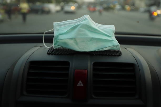 istock Face Mask in car on the console 1357618476