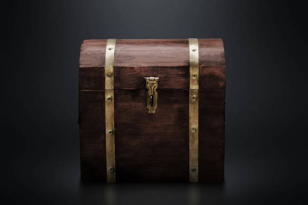 istock Wooden treasure chest on dark background 1357620906