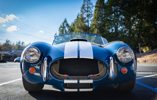 Placerville, USA - November 25, 2020: Classic rare American muscle car, convertible vintage blue 1967 Ford Shelby Cobra 427