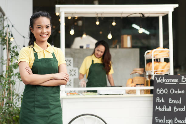 istock Smiling Young Street Vendor 1357628509