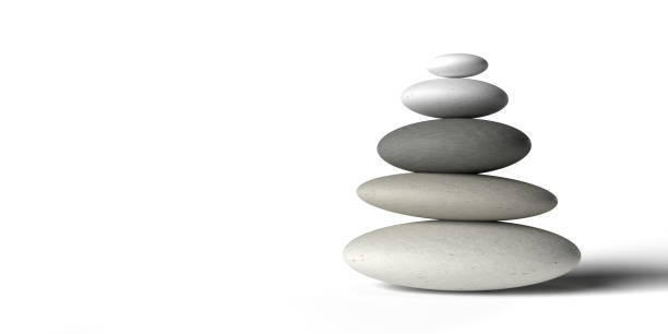 istock Stacked pebbles close up on white background with copy space. 1357628662