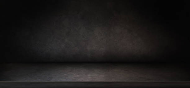 istock Empty black dark concrete shelf used as background studio wall for display your products 1357629436