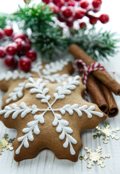 Christmas gingerbread with christmas decorations on white wooden
