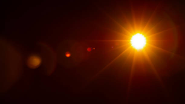 istock Sun flare on the black background 1357631205