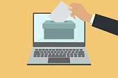 istock Online Voting Concept With Hand Putting Voting Paper In The Ballot Box On Laptop Screen 1357631304