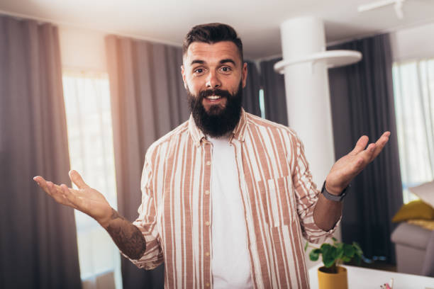 istock Portrait smart confident smiling millennial man standing at home 1357633336