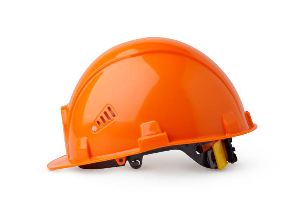 Orange plastic safety helmet isolated on white background
