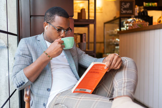 istock Man Reading At Coffee Shop 1357635875