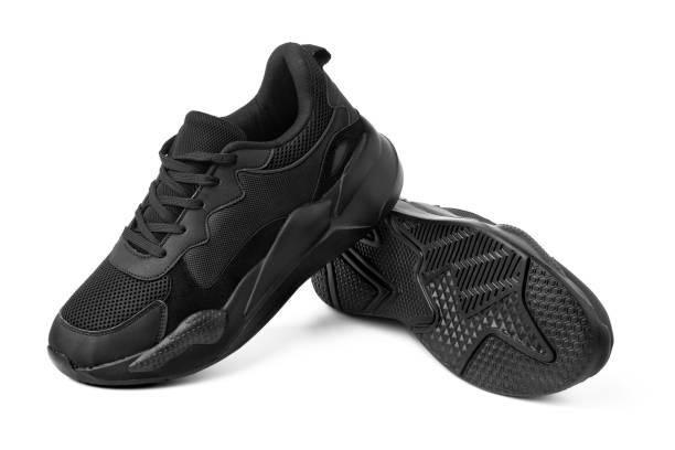 istock New black sneakers isolated on white background 1357640243