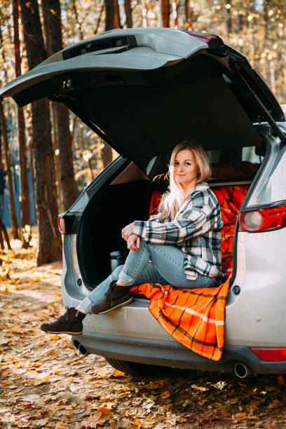 istock girl drinking coffee in a car 1357641778