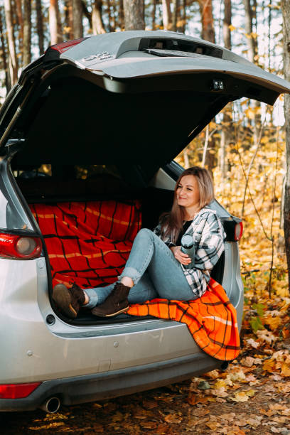 istock girl drinking coffee in a car 1357641886
