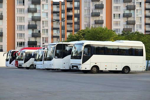 Side view of buses at a bus station.
