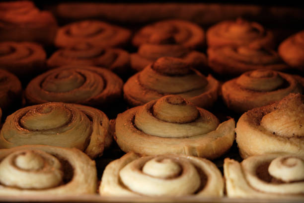 Cinnamon rolls are baked in oven, homemade cakes