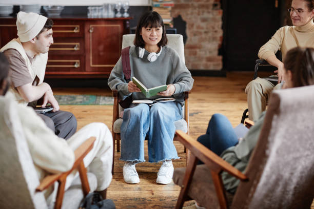 istock Woman reading a book for students 1357644525