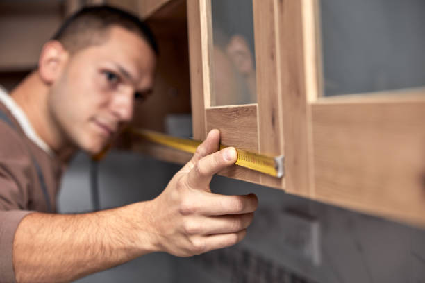 istock Handyman making kitchen wall cabinets in the apartment. 1357645971
