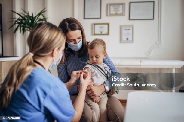 Little Boy Getting Vaccinated Stock Photo - Download Image Now - Doctor, Protective Face Mask, Child