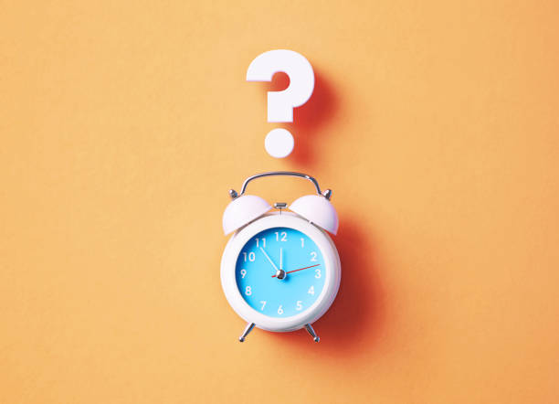 istock White Alarm Clock Sitting Below White Question Mark On Salmon Background 1357647070