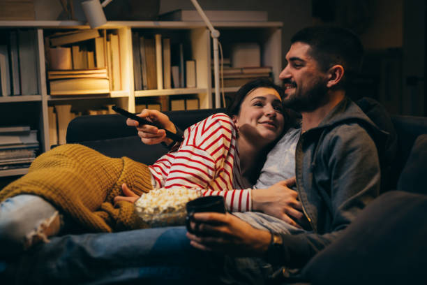 istock young couple relaxing at home . evening scene 1357647363