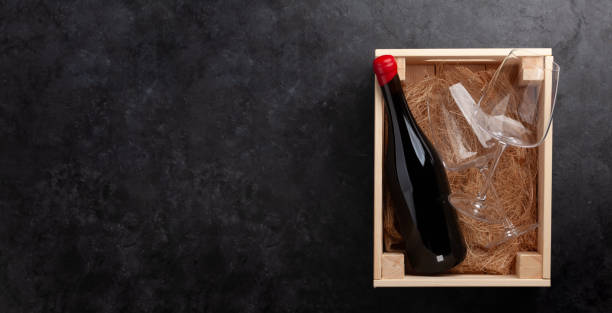 istock Red wine and glasses in wooden box 1357648186