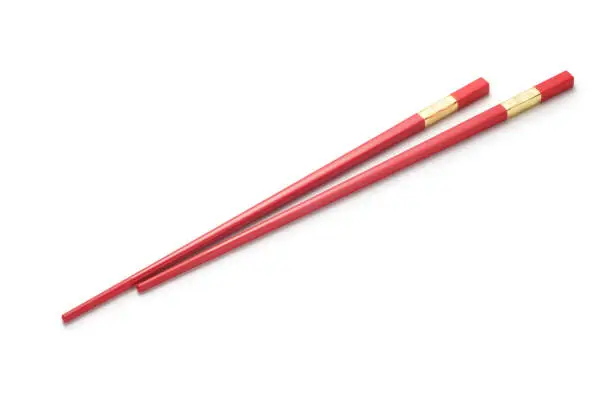 Red chopsticks on white background