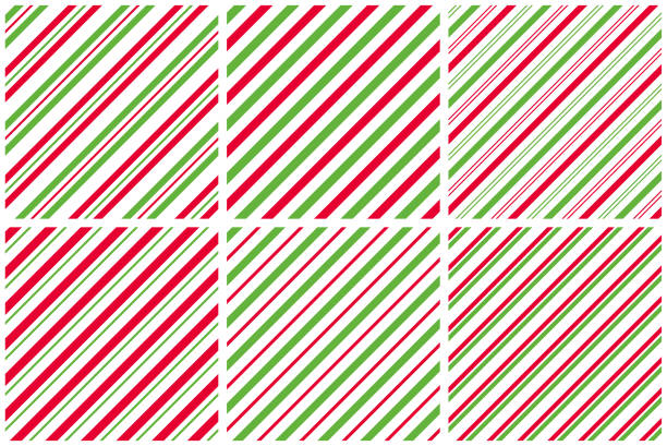 Seamless patterns Set of seamless patterns. Red and green diagonal lines on a white background. Vector striped backgrounds. candy cane striped stock illustrations