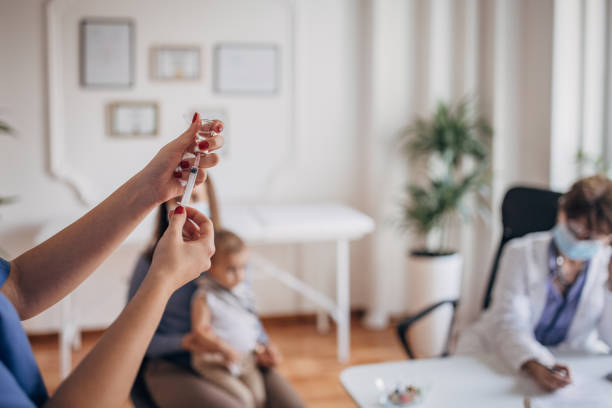 istock Nurse preparing vaccine 1357649338