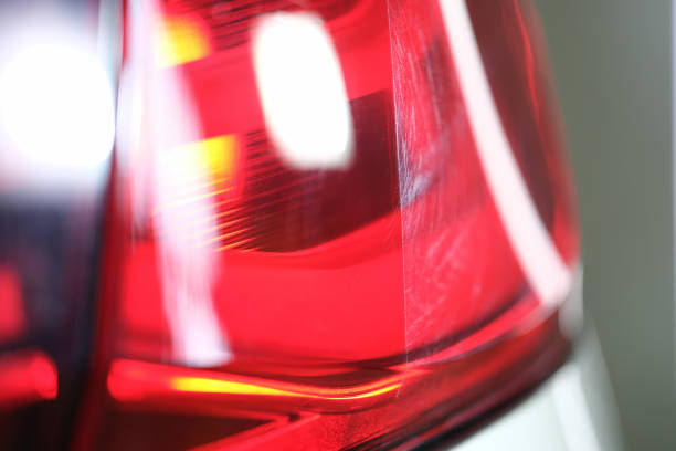 istock Bright red headlight of a car, close up. Headlamp 1357649787