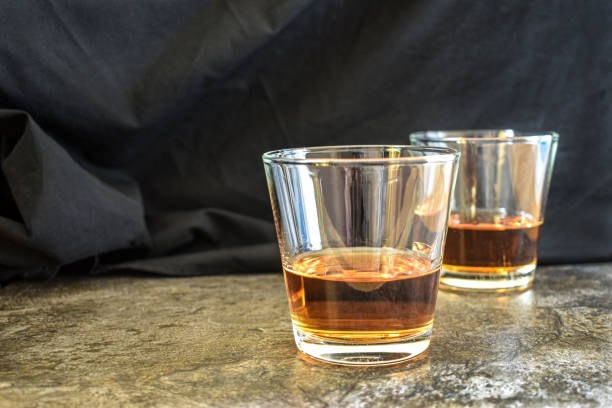 istock Two glass of whiskey on marble table. 1357650106