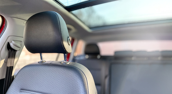 Close-up of a car seat headrest. Photography of the car interior.
