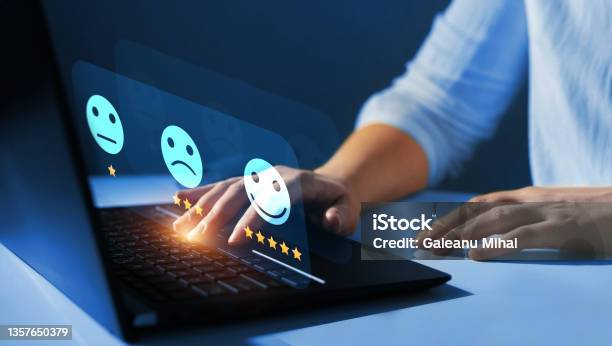 Woman Who Gives Leave Feedback On The Bought Product With Gold Five Star Rating Feedback On Virtual Sreen Customer Review Satisfaction Feedbackconcept Of Satisfaction Quality And Performance Stock Photo - Download Image Now