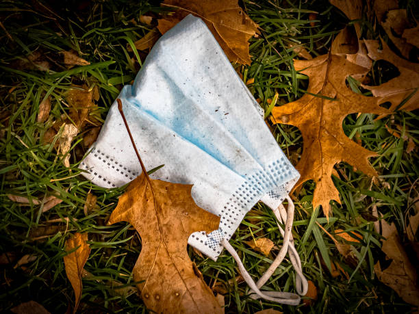 istock Personal Face Mask Abandoned in Grass 1357650903