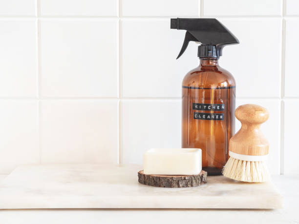 istock Amber bottle with washing solution, brush and soap on a marble shelf. 1357651234