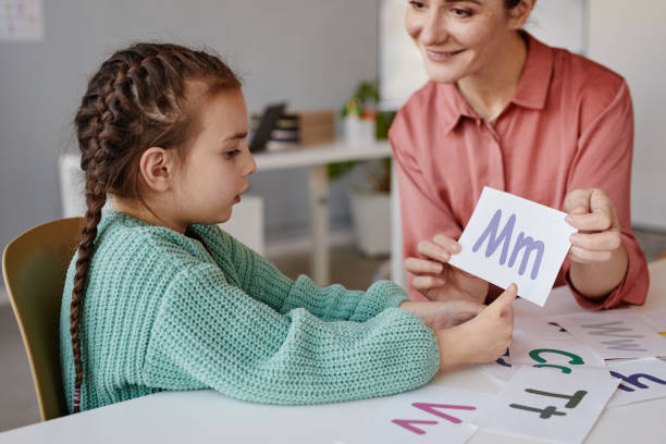 istock Little girl learning the English alphabet 1357653726