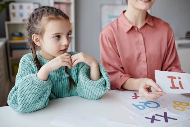 istock Girl sitting at English lesson 1357653739