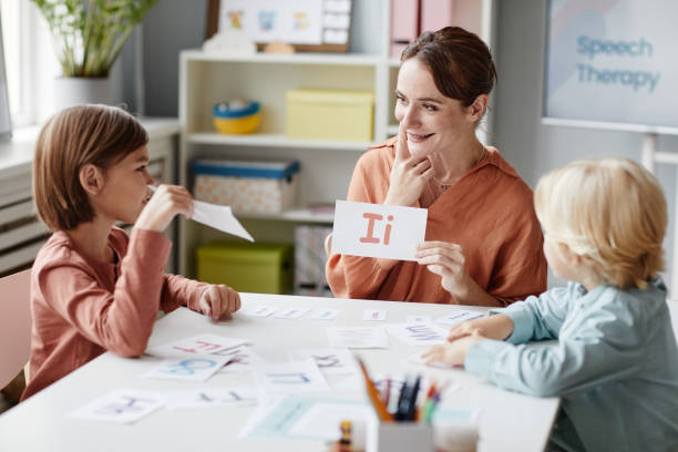 istock Woman teaching English children 1357653745