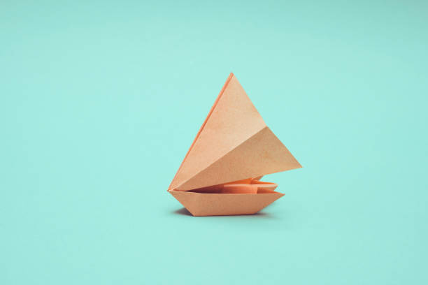 Paper boat on color backround