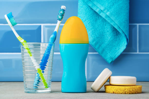 istock The toothbrushes in a glass in blue bathroom. 1357654247