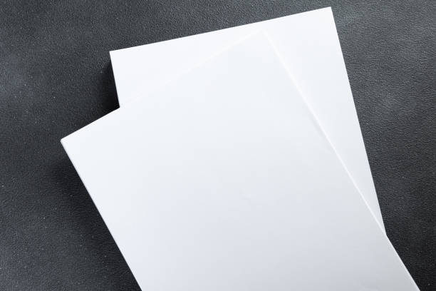 istock Blank a4 poster flyer isolated on gray to replace your mockup design 1357654992