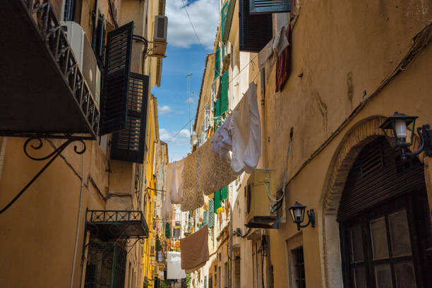 istock Washed laundry is dried on clothesline in Corfu, Greece. 1357657029