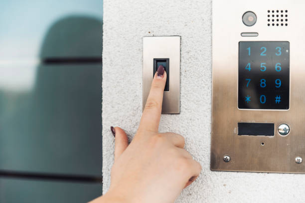 istock Unlocking the door with a fingerprint 1357657209