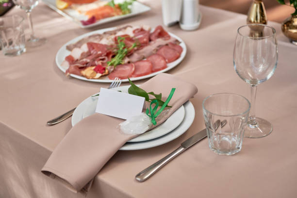 istock Table setting with sparkling wineglasses, plate with beige napkin and cutlery on table, copy space. Place set at wedding reception. Table served for wedding banquet in restaurant 1357657338