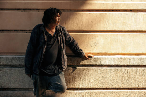 istock Homeless man looking away thoughtfully outdoors 1357658552