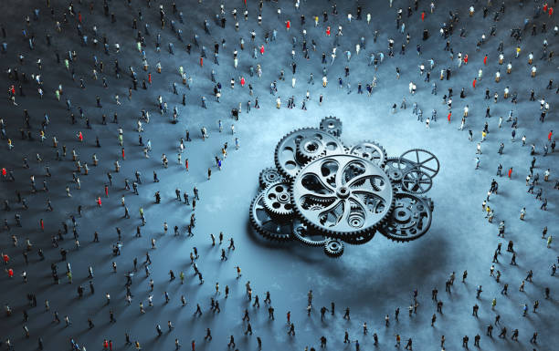 istock Crowd of people around cog wheels mechanism. 1357658832