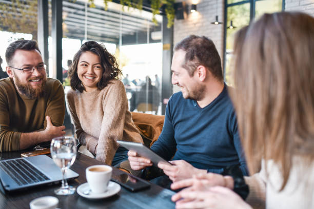 istock Happy Couples Talking About Technology And Freelance Work During Coffee Time Together 1357659724