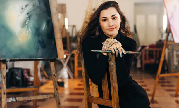 istock Young female artist looking at the camera confidently 1357660773