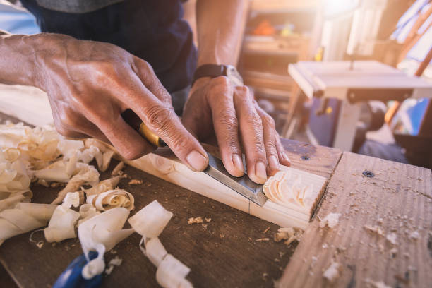 istock Carpenter working with equipment on wooden 1357660944