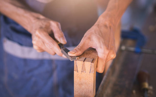 istock Carpenter working with equipment on wooden 1357660947