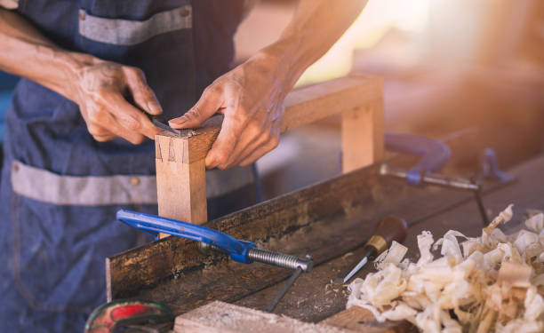 istock Carpenter working with equipment on wooden 1357660978